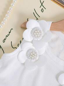 Bộ đồ hai mảnh dành cho bé gái, gồm áo trễ vai dễ thương và đơn giản với họa tiết hoa và chân váy ngắn màu xanh bạc màu in hình trái cây. Hoàn hảo cho mặc hàng ngày và những chuyến đi chơi nghỉ mát. - Nhiều màu - Xem 4