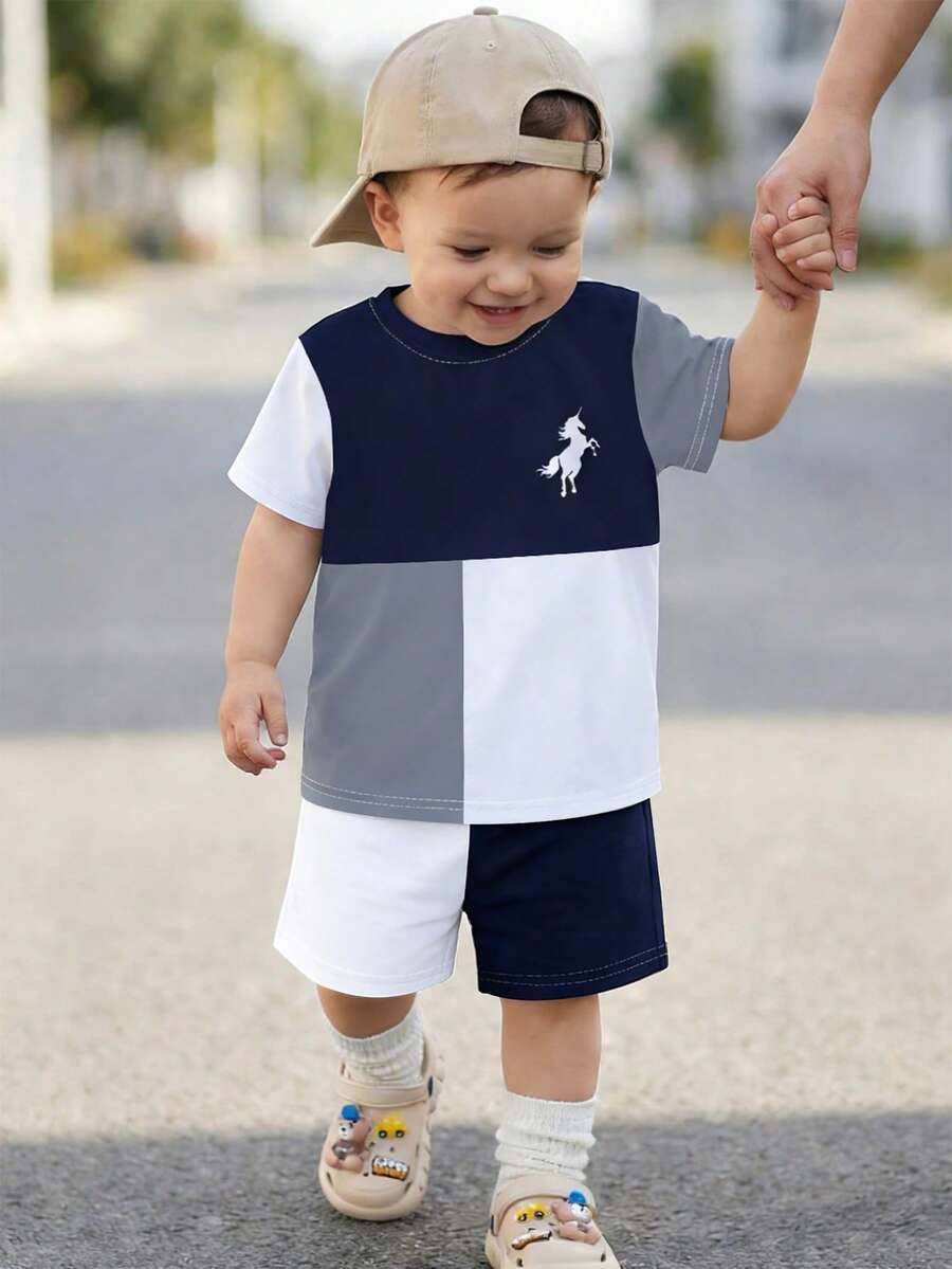 一套幼儿简约风格白色、灰色、藏青色拼接短袖短裤套装，无绒面料，舒适日常及春夏穿着
