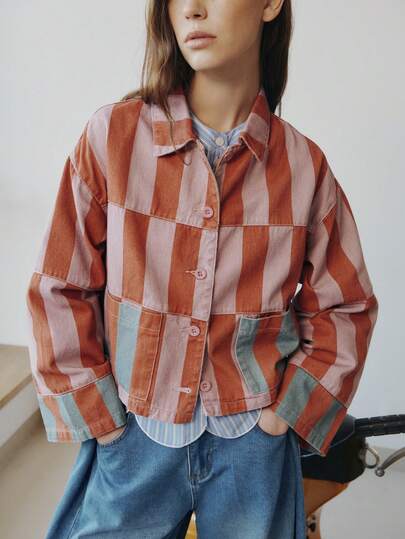 Nöista Women's Striped Cropped Jacket In Warm Pink And Rust Tones With Contrast Patch Pockets And Relaxed Fit. Lightweight Cotton Fabric With Button-Front Closure And Modern Boxy Silhouette-Perfect For Spring Layering, Casual Chic, Everyday Wear, Summer Styling, And Summer Seasons.