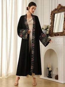 Al Najma Women's Modest Elegant Embroidered Flare Sleeve Loose Arabic Abaya Robe - Black - View 1