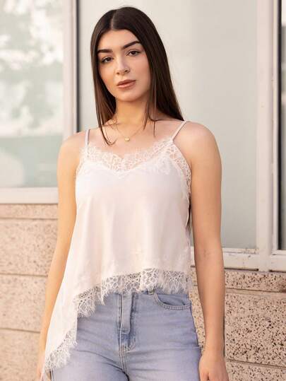 Andrea Bello Blusa suelta con tirantes finos, borde de encaje y bajo asimétrico de unicolor para mujer
