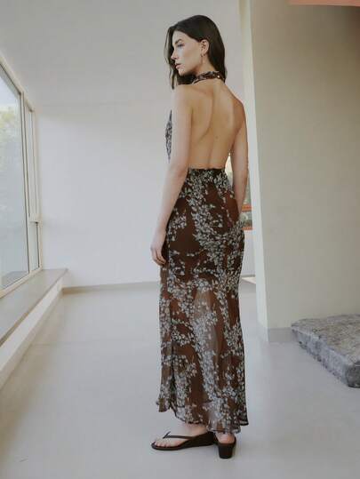 Nöista Halter-Neck Maxi Dress Features A Brown Base With Blue Floral Prints. Evening Events, Guest Weeding Dress, Easter, Spring, Summer, Women Outfit, Woman.