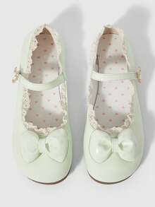 Green solid color lace + polka dot bow.