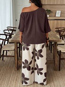 Weeklong Bộ đồ nữ cỡ lớn gồm áo kiểu dáng rộng rãi cổ lệch và quần ống rộng họa tiết hoa, thích hợp cho kỳ nghỉ hè/thu. - Nhiều màu - Xem 2