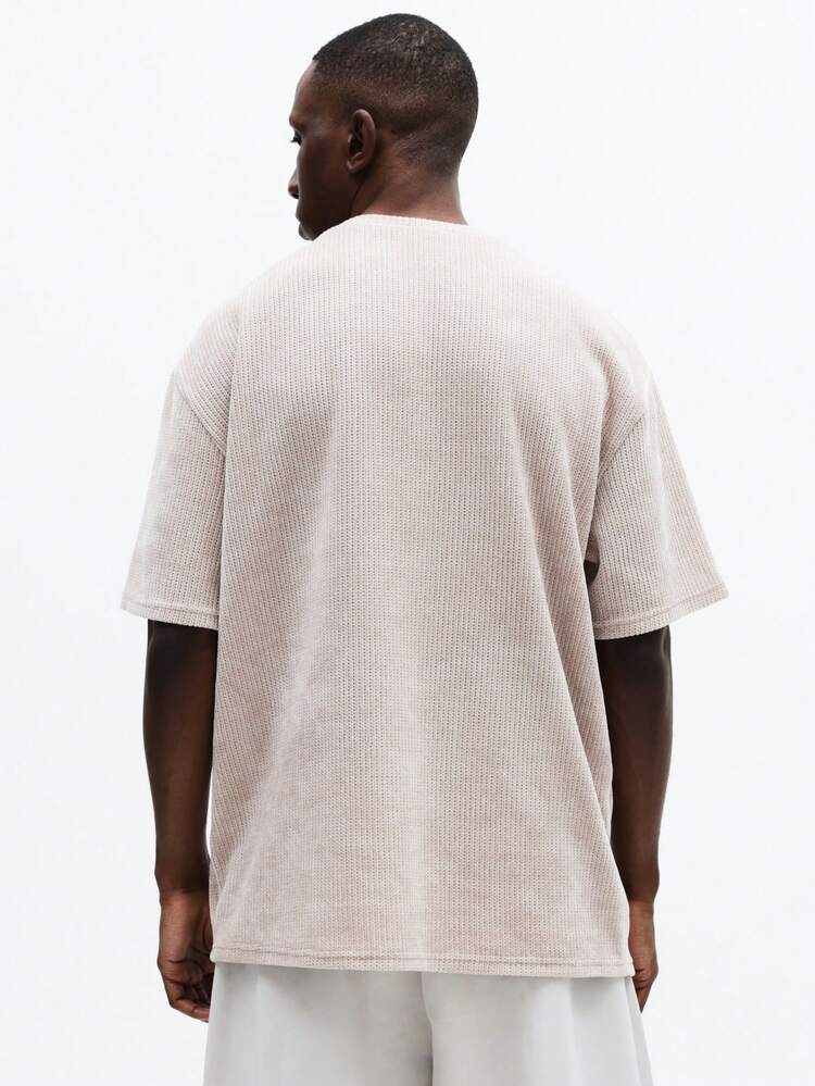 Camiseta de punto con cuello redondo y textura acanalada