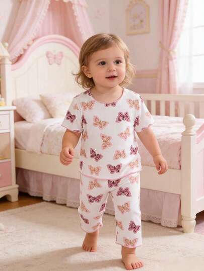 Pijama para niñas bebé - Conjunto de 2 piezas con estampado de mariposa, blusa de manga corta y cuello redondo a juego con pantalones largos de cintura elástica, ligero y suave, ropa de dormir de verano, regalo, 2026, lindo color pastel rosa melocotón