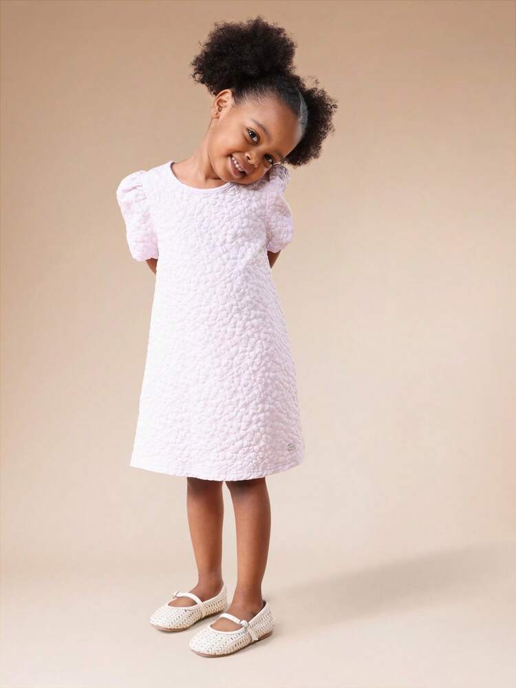 Robe courte texturée à manches bouffantes et découpe