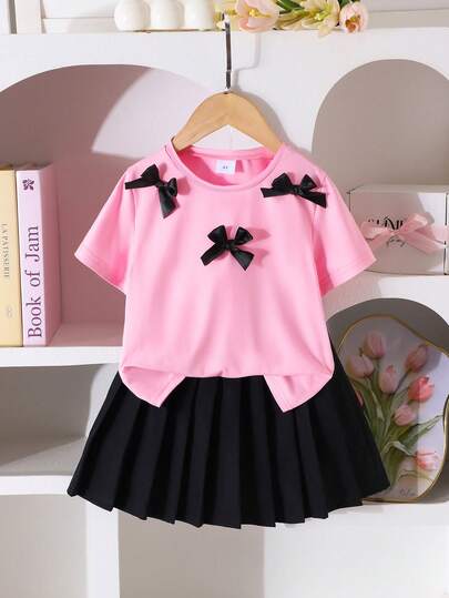 2pcs/Set Young Girl Sweet School Style Suitable Ribbon Bow Pink Short Sleeve Top Paired With Black Pleated Skirt, Casual Minimalist T-Shirt Set Suitable For Leisure, Daily Wear In Summer