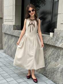 Firerie Kids 少女新款圆领镂空撞色系带腰侧荷叶边下摆无袖褶皱连衣裙，后背拉链，时尚、年轻、优雅、百搭，收腰设计，适合春、夏、秋、冬四季穿着。 - 杏色 - 查看 7