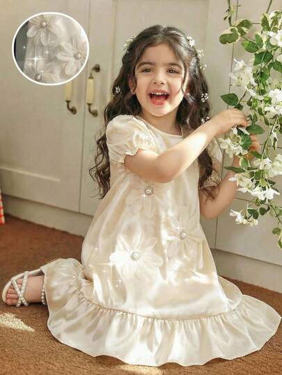 This Adorable Single-Piece Dress For Young Girls Comes In A Soft Beige Color With A Classic Round Neck And Sweet Puff Sleeves. The Ruffled Cuffs And Hem Add A Delicate, Playful Touch, While Charming Floral Accents Enhance Its Elegant Yet Simple Style. Perfect For Special Occasions, Parties, Or Any Event Where Your Little One Wants To Shine Like An Arabian Little Princess. Fancy Girls Dress Girls Maxi Dress Cream Dress For Girls Ivory Dress For Girls Beige Dress For Kids Girls Maxi Long Dress