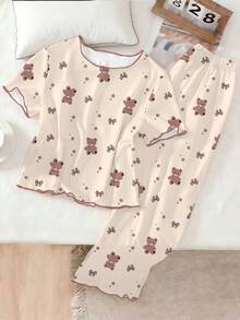 Genkimix Kids 少女两件套睡衣套装，包括一件印满小熊和蝴蝶结图案的T恤，搭配一条宽松的印花荷叶边裤，适合春夏休闲居家穿着。 - 杏色 - 查看 4