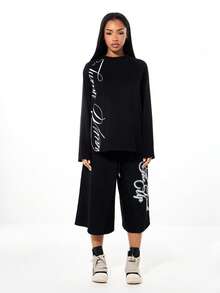 SUMWON WOMEN SUMWON 女款宽松插肩长袖印花T恤，正面印有文字图案，圆领设计，适合日常休闲穿着 - 黑色 - 查看 5