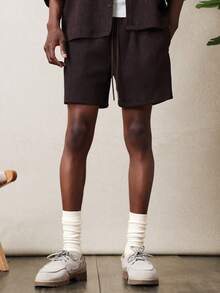SUMWON Ensemble coordonné de deux pièces avec chemise à boutons texturée côtelée et short à cordon de serrage, idéal pour les vacances - Noir - Voir 4