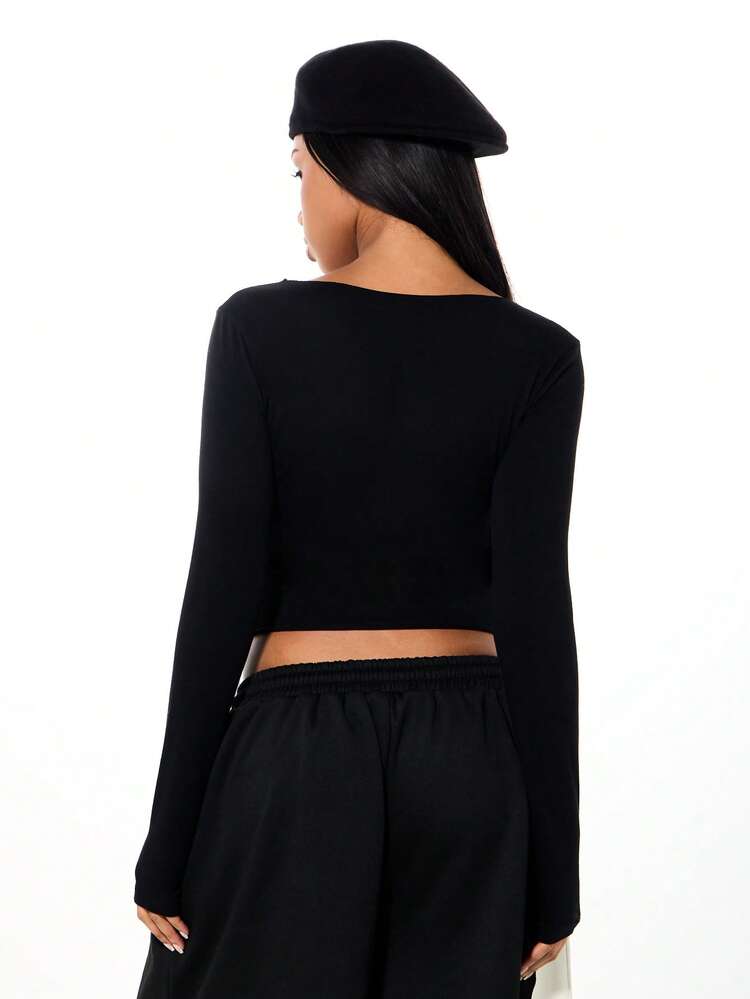 SUMWON WOMEN Long Sleeve Crop Top With Bold Typography Print Deep Scoop Neckline Fall Winter Plain Streetwear