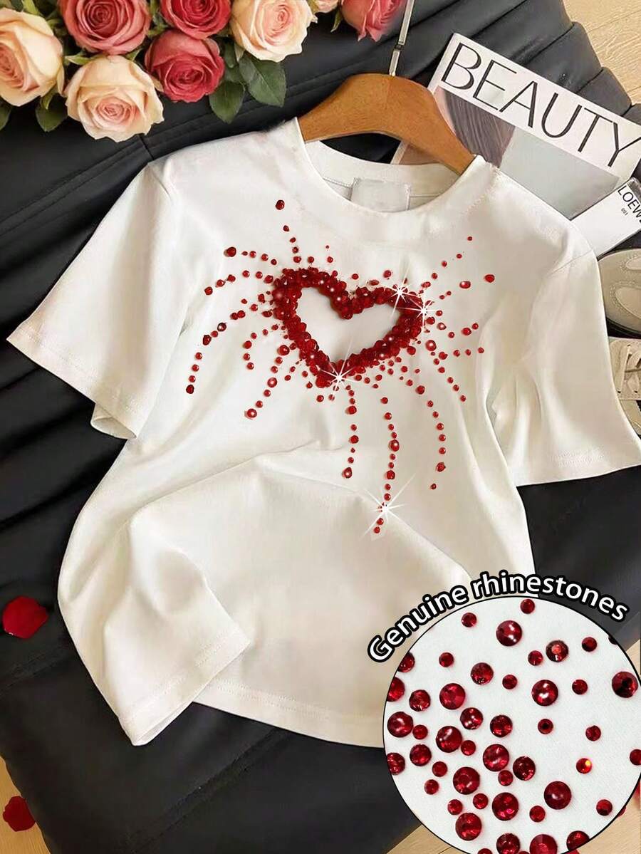 Resyla Áo thun nữ cổ tròn tay ngắn đính đá giả hình trái tim rỗng - trắng - Xem 1