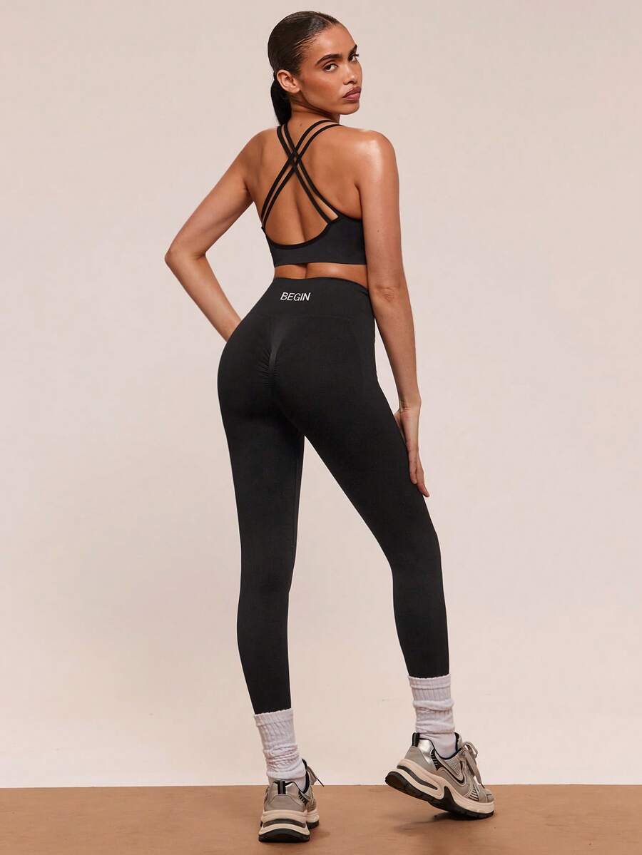 SHEIN BAE Conjunto deportivo casual de mujer compuesto por top de tirantes finos con espalda cruzada y pantalón de un solo color, conjunto de ropa deportiva minimalista para mujer - Negro - Ver 1