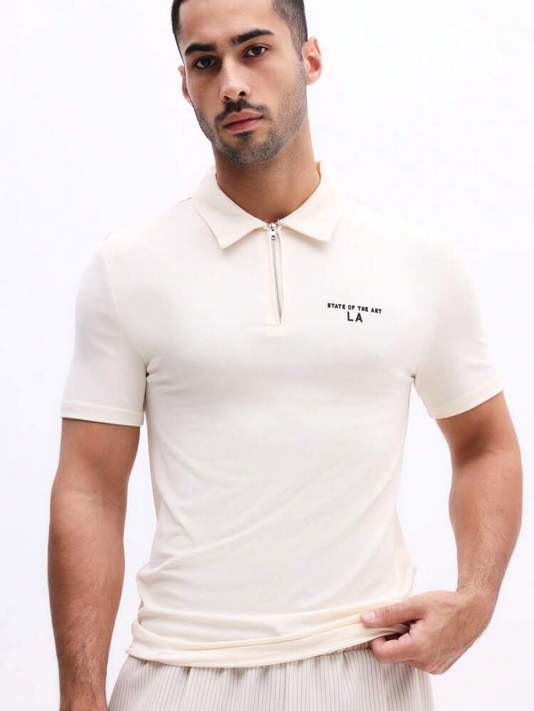 Polo con cremallera de un cuarto y estampado en el pecho