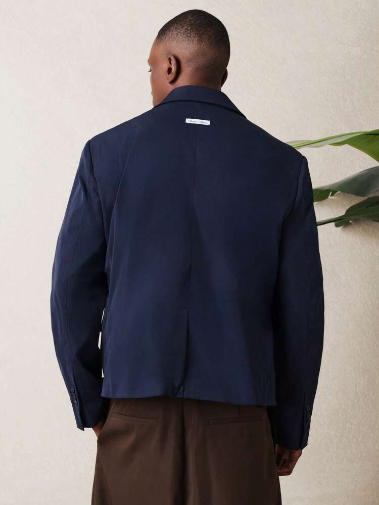 Blazer de abotoamento duplo com lapelas em bico