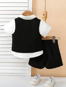 SHEIN Bộ đồ 3 món cho bé nhân Ngày của Mẹ đầu tiên - Áo ba lỗ, nơ bướm và quần short. Áo ba lỗ màu đen nhạt với chi tiết cúc trang trí, đi kèm với nơ bướm nhỏ nhiều màu. Quần short cũng màu đen nhạt để ton sur ton với áo ba lỗ. Thích hợp cho các dịp lễ của trẻ em như đám cưới nhỏ hoặc các buổi biểu diễn của trẻ. - màu đen - Xem 2