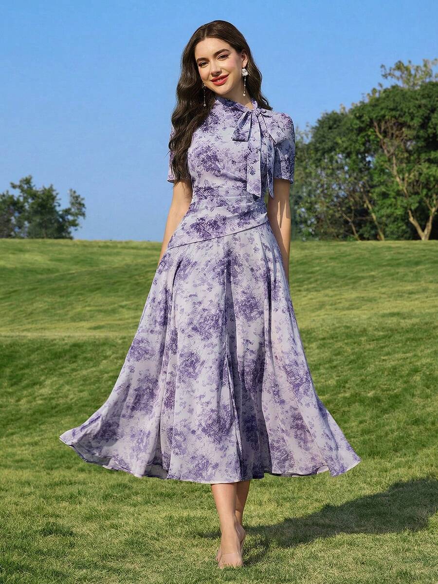 Modelyn Đầm nữ thanh lịch in hoa, cổ xoắn, eo nhún, thích hợp cho mùa hè. - Màu tím - Xem 1
