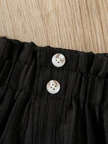 SHEIN Pantalones cortos plisados con botones de unicolor para niñas, adecuados para salidas diarias, deportes, vacaciones, parque - Negro - Ver 6