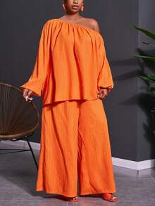 Veslaya Bộ trang phục 2 mảnh dành cho nữ cỡ lớn mùa Xuân & Hè 2026, thích hợp cho các lễ hội âm nhạc, lễ Phục Sinh, phong cách miền Tây, du mục, tiệc sinh nhật, lễ tốt nghiệp, phong cách sinh viên, mặc hàng ngày, cơ bản, đa năng, thường ngày, kỳ nghỉ, du lịch biển, tắm nắng, xu hướng thịnh hành, cao cấp, thanh lịch. Áo tay dài tay phồng dáng chữ A và quần ống rộng, chất liệu vải nhăn màu cam, kiểu dáng bất đối xứng vai và quần ống rộng, gồm áo và quần ống rộng. - trái cam - Xem 9
