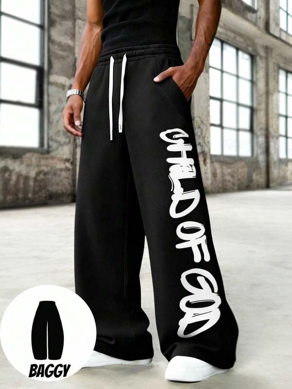 Manfinity EMRG Baggy Pants Black & White Contrast Stripe Casual Pants, Oversized Cleaver Leg Silhouette Sweatpants, American Streetwear Style, Relaxed Fit, Versatile Men's Sweatpants Mens Letter Print Elastic Pants Bottoms  Valentines Gifts For Boyfriend