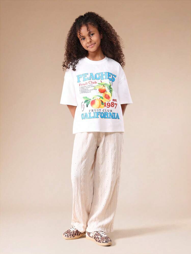 Conjunto de camiseta com estampa de pêssegos e calça pantalona