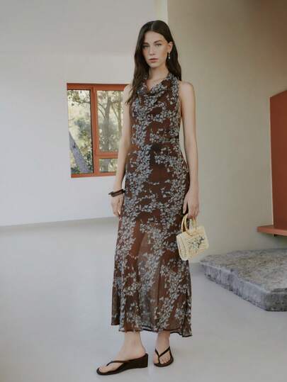 Nöista Halter-Neck Maxi Dress Features A Brown Base With Blue Floral Prints. Evening Events, Guest Weeding Dress, Easter, Spring, Summer, Women Outfit, Woman.