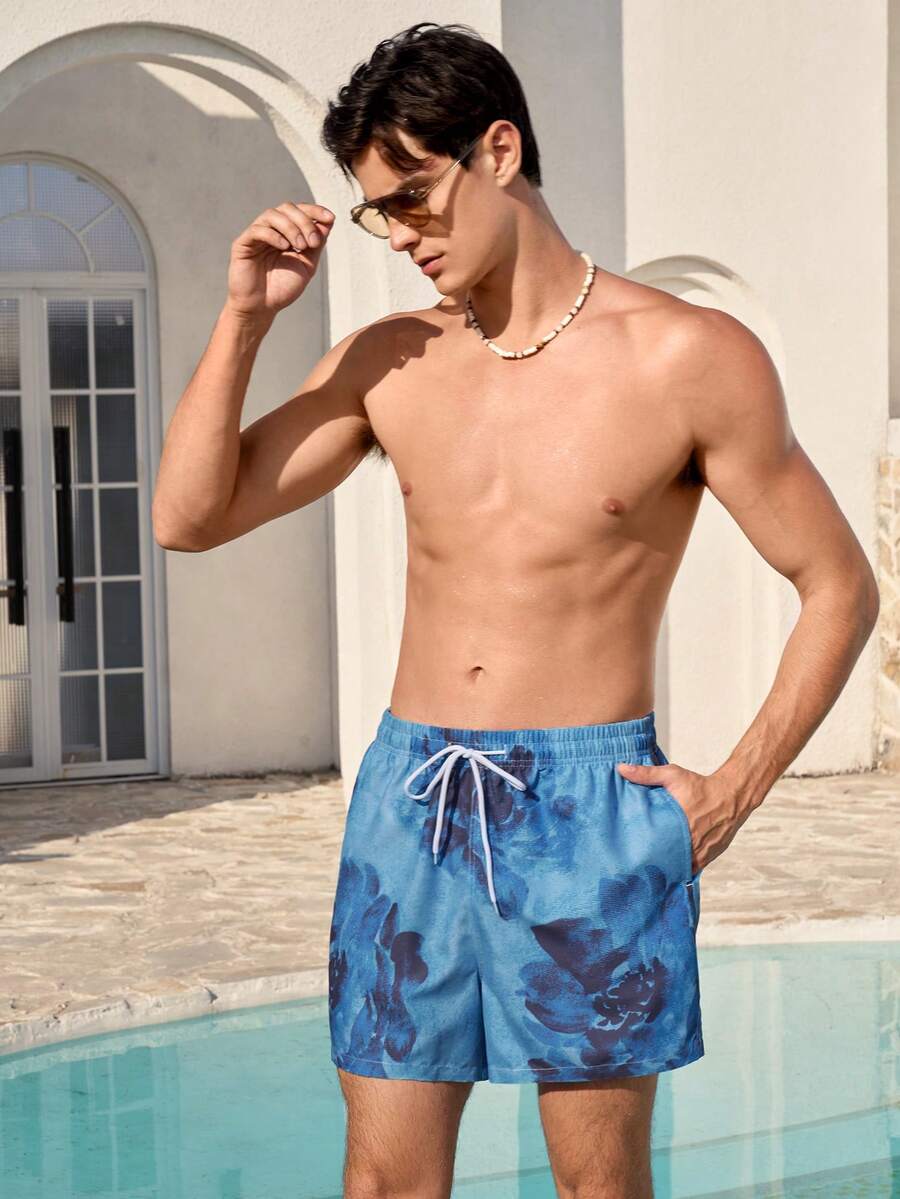 Manfinity VDAYZ Quần short đi biển nam cạp chun, dây rút, dáng rộng, có túi, quần bơi nam, đồ đi biển nam, trang phục nghỉ dưỡng nam, quần bơi nam họa tiết hoa màu xanh dương. - Nhiều màu - Xem 1