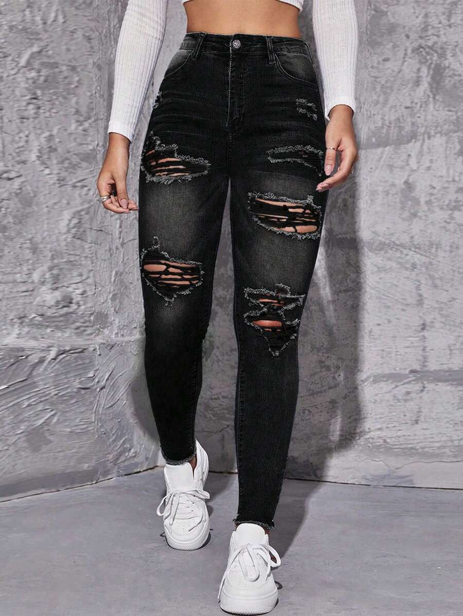 Flexra Jeans pitillo con dobladillo deshilachado y desgastado, estilo casual y chic para uso diario y trayectos - Negro - Ver 1