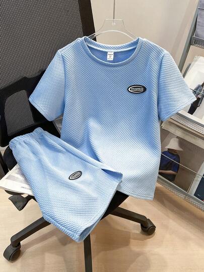 SHEIN Set de 2 piezas de camisa de cuello redondo y pantalones cortos con estampado decorativo de goma texturizada para niños preadolescentes, adecuado para ir al trabajo, la escuela, salidas casuales diarias, deportes, primavera/verano