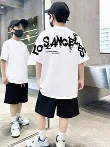 SHEIN 青少年男童休闲撞色印花短袖T恤和短裤两件套,舒适百搭,适合日常穿着、上学、郊游、户外活动、音乐节、假期、海滩度假、夏季、春夏穿着。 - 黑與白 - 查看 9