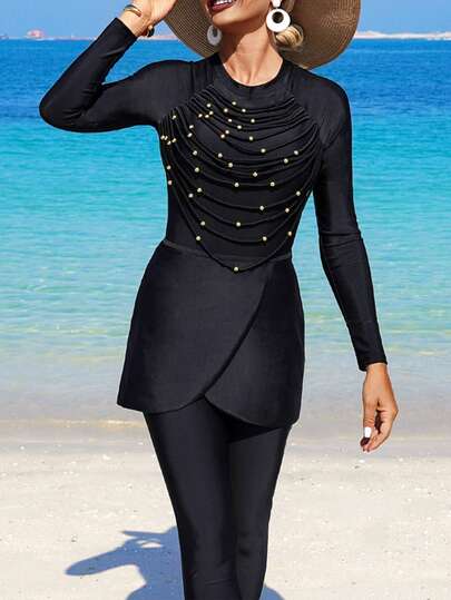 Swim Mulvari Bộ Burkini 3 món dành cho nữ, đính cườm và tua rua: Áo Burkini, quần Burkini và váy quấn.