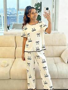 Genkimix Kids 1 set Pijama para niñas preadolescentes, base color albaricoque con estampado de mariposas, ribete de contraste, manga corta y pantalón largo, conjunto de ropa de dormir casual - Albaricoque - Ver 3