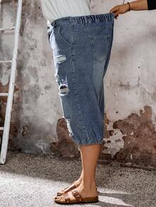 EMERY ROSE Quần jean denim rách dài 7/8 cỡ lớn, quần capri denim rách cỡ lớn dành cho nữ - quần jogger cạp chun, trang phục thường ngày mùa hè, quần capri denim rách cỡ lớn dành cho nữ phong cách đường phố Y2K, quần capri denim rách thanh lịch dành cho nữ - quần jogger cạp chun, quần capri denim màu sáng cỡ lớn dành cho nữ, thiết kế cạp cao, chi tiết rách nhiều, cạp chun phía sau tạo sự thoải mái cả ngày và gấu quần kiểu jogger. Chất liệu denim mềm mại, co giãn, nhiều túi, hoàn hảo cho trang phục hàng ngày mùa hè, kỳ nghỉ, phong cách đường phố Y2K thường ngày, quần capri denim, denim rách, cạp chun, quần jogger, quần mùa hè, Y2K, phong cách, thời trang đường phố thường ngày. - Màu xanh lam - Xem 6