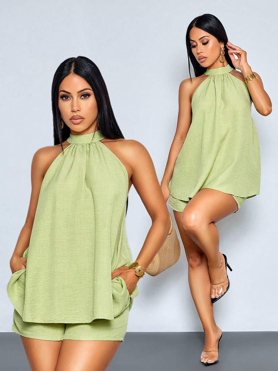 SOLERSUN 性感优雅的休闲沙滩度假两件套，薄荷绿露背吊带上衣搭配同色短裤，饰有不对称下摆。是约会和派对的完美之选。春夏女装时尚，尽显复古韵味。Kizn 女士度假套装，女士夏季套装，女士露背吊带上衣短裤套装，女士夏季两件套，鼠尾草绿女士套装，橄榄绿女士休闲两件套。