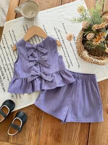 SHEIN Bộ đồ đôi cho bé gái màu tím nhạt dễ thương, có nơ trang trí, kiểu dáng thoải mái, thích hợp cho kỳ nghỉ, gồm áo hai dây và quần short, màu xanh tím nhạt, kiểu dáng hở lưng, thích hợp cho trẻ em. - Màu tím - Xem 7