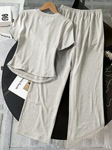 Bộ áo thun ngắn tay cổ tròn in họa tiết đơn giản dành cho bé gái tuổi teen và quần dài. - Xám - Xem 2