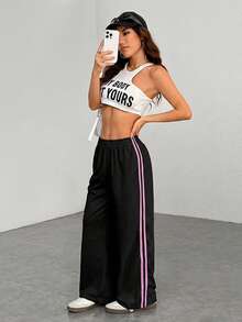 SHEIN EZwear Quần dài nữ cỡ lớn màu đen kẻ sọc bên hông, kiểu dáng tối giản và thời trang, phù hợp cho trang phục thường ngày, mùa tốt nghiệp, tựu trường, lễ tốt nghiệp, trang phục giáo viên nữ, trang phục thể thao học đường mùa tựu trường, bộ đồ thể thao nữ. - màu đen - Xem 3