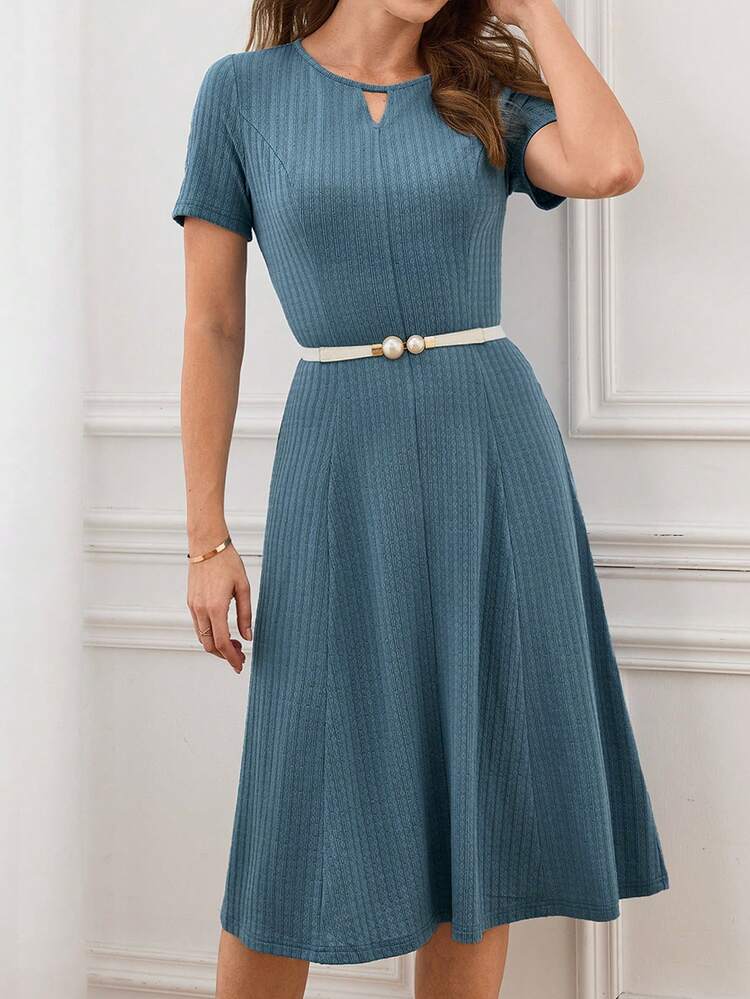 This Elegant Women's Dress Features A Misty Blue Color That Exudes A Sophisticated Feel, Making It A Perfect Base For Any Work Outfit. The Floral Pattern Is Created With A Vertical Stripe Textured Fabric, And The Minimalist Cut Reveals A Subtle Yet Refined Quality. The Dress Boasts A Small V-Neck, Short Sleeves, A Fitted Waist, And A Full Skirt. The Textured Fabric Flatters The Figure, And The Flowing Cut Balances Elegance And Comfort. Suitable For Spring And Autumn, And Appropriate For Both Work And Casual Gatherings, This Dress Conveys A Composed Style With Its Misty Blue Base And Showcases Fashionable Sophistication With Its Textured Details. It's A Versatile And Elegant Choice For Any Wardrobe, Suitable For Both Seasons.
