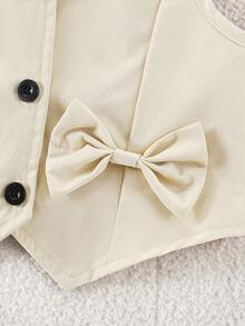 SHEIN Vintaside Kids Set de 2 piezas de camiseta sin mangas beige con lazo decorativo con botones delanteros y pantalones de pierna ancha, conjunto informal adecuado para uso diario, eventos, ocasiones formales, vuelta al colegio - Albaricoque - Ver 7