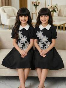 Spring/Summer New Style Girls' Black Collar Short Sleeve Dress, Decorated With 5 Dimensional Flowers On The Chest, Adding Childlike Charm And Cuteness, Overall Sweet And Elegant Style, A-Line Skirt Design For Dynamic And Lively Look, Suitable For Daily Outings, Performances, Gatherings, Etc. 3d Flowers Dress Black And White Kids Dress Daisy Dress Toddler Girl Clothing Girl Dress 3d Floral Girls Dresses Black Dresses For Girls Kids Uniform Dresses Girls Collared Dress - Black - View 1