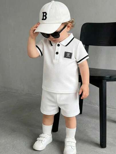 SHEIN Playful Pals 2pcs/Set Baby Boy Waffle Polo Collar Half-Placket White Solid Color Short Sleeve Shorts Set, Cuffs With Black & White Rib Knit, Minimalist Sophisticated Style, Casual Gentleman Look