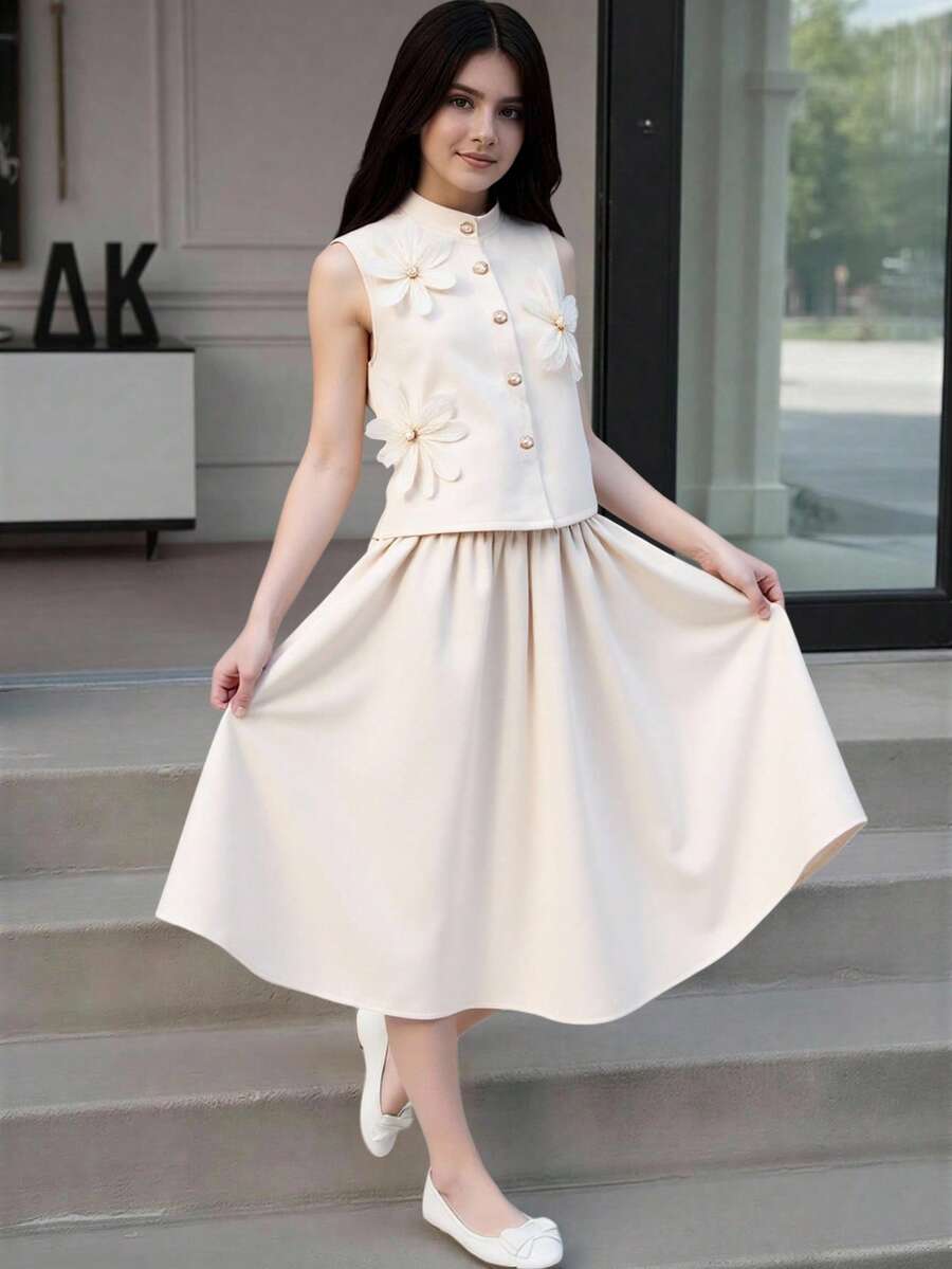 SHEIN ChillGRL 女童两件套：纯色 A 字裙搭配无袖无领开衫背心，饰有花瓣图案，适合春夏日常休闲穿着。 - 杏色 - 查看 1