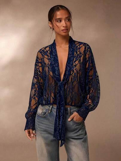 SHEIN Glamour Women's Solid Color Knotted Sheer Lace Long Sleeve Blouse Navy Blue Sheer Lace Tie Front Blouse Modest Deep V Neck Long Sleeve Lace Top Wedding Guest Navy Modest Lace Blouse Elegant Deep V & Tie Front Silhouette Spring Break Boho Chic Outfit Coachella Festival Edgy Sheer Lace Look Date Night Sexy Lace Tie Front Top Garden Party Modest Sheer Lace Blouse Beach Vacation Cover-Up Lace Blouse Premium Sheer Floral Lace Fabric Navy Blue / Midnight Blue Color Palette Loose Fit & Sheer Silhouette Lace Ti