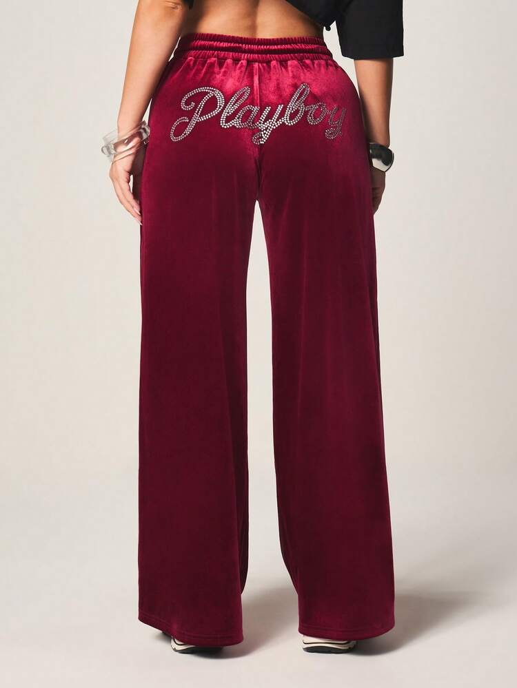 Missguided x Playboy Luxurious Burgundy Velvet Wide Leg Sweatpants With Drawstring Waist And Rhinestone Text Detail For Casual Comfort And Loungewear