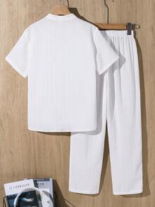 SHEIN 2 piezas Conjunto informal de vacaciones para niño preadolescente, versátil, de unicolor, tela texturizada, camisa y pantalones a rayas de onda blanca, adecuado para ir al trabajo, la escuela, el uso diario casual, deportes, primavera/verano - Naranja - Ver 2