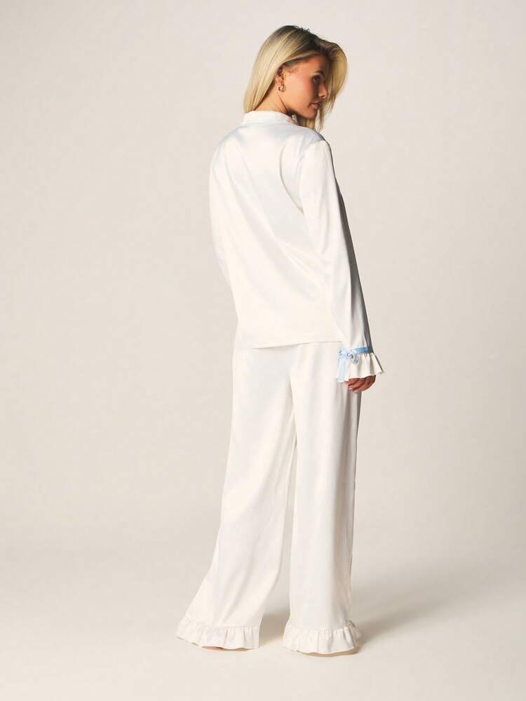 MISSGUIDED Ensemble de pyjama avec boutons, nœud papillon bleu clair aux poignets et ourlet à volants. Ensemble de détente pour le sommeil.