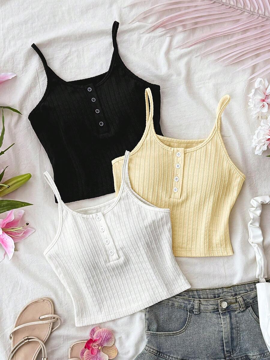 SHEIN Glamour Áo hai dây cổ điển đa năng kết hợp với kiểu dáng crop top hở eo, được trang trí bằng hàng cúc phía trước giúp giảm sự nhàm chán khi phối đồ. Có thể mặc riêng hoặc phối cùng quần jeans, chân váy để tạo vẻ ngoài thường ngày; cũng thích hợp làm áo lót để mặc cùng áo sơ mi, áo blazer, áo cardigan khi đi làm, hẹn hò hoặc đi chơi. - Nhiều màu - Xem 1